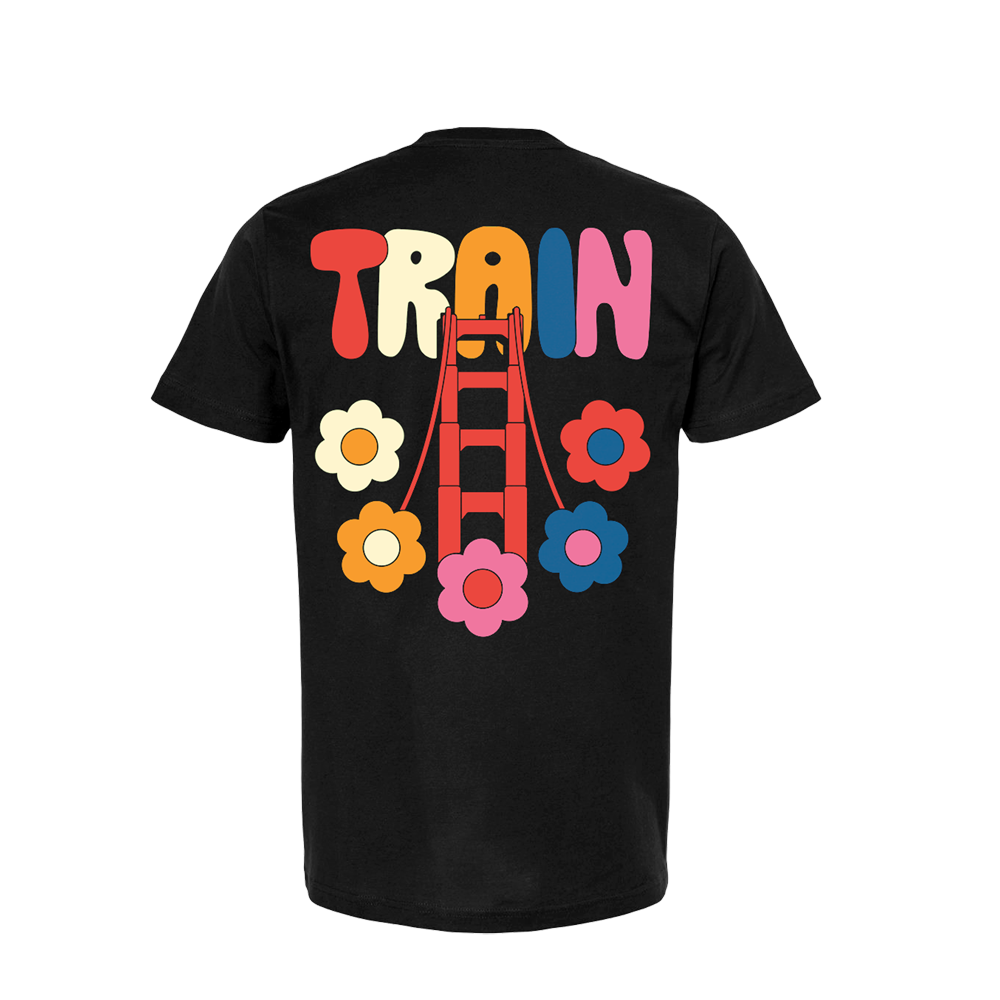 Black t-shirt with colorful ’TRAIN’ text and flower designs on the back.