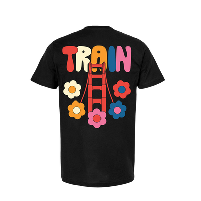 Black t-shirt with colorful ’TRAIN’ text and flower designs on the back.